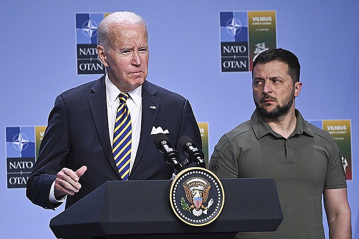 President Joe Biden, left, speaks at an event with G7 leaders and Ukrainian President Volodymyr Zelensky during the NATO Summit, in Vilnius, Lithuania, July 12, 2023. Biden's strong backing for Ukraine's effort to repel Russia's invasion has been the rare issue where he's mustered bipartisan support. But this week’s first GOP presidential debate—and recent comments by former President Donald Trump on Ukraine— suggest that the dynamic will face a stress test as the 2024 presidential campaign heats up. (Paul Ellis/Pool Photo via AP)