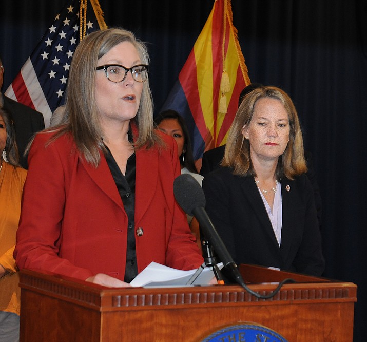 Flanked by Attorney General Kris Mayes, Gov. Katie Hobbs said Tuesday the state has been the victim of massive fraud caused by operators of sober living homes signing up Native Americans for care — needed or not — and then not providing services. (Howard Fischer/Courtesy)