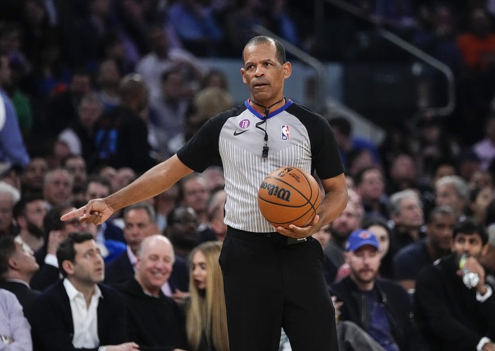 Referee Eric Lewis gestures during the first half of Game 5 of the NBA basketball Eastern Conference semifinal between the New York Knicks and the Miami Heat, May 10, 2023, in New York. Lewis, one of the NBA's top referees, has retired effective immediately in the wake of a league investigation into whether he used a then-Twitter account to defend himself and other officials from online criticism. The league announced his retirement Wednesday, Aug. 30, 2023. (Frank Franklin II/AP, File)