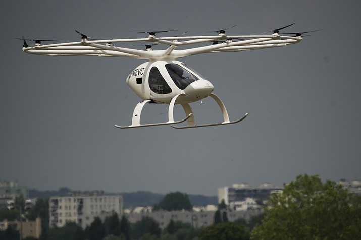The Volocopter 2X, an electric vertical takeoff and landing multicopter, performs a demonstration flight during the Paris Air Show in Le Bourget, north of Paris, France, Monday, June 19, 2023. (Lewis Joly/AP)