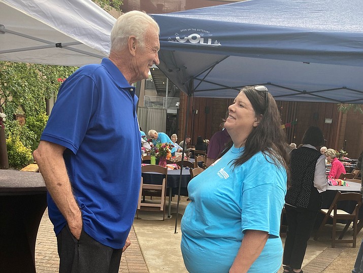 U.S. VETS Prescott Executive Director Carole Benedict speaks to one of the agency’s donors, Frank Hahn, during the 2023 Donor Appreciation Party at the Grand Highland and Holiday Courtyard in Prescott on Thursday, Aug. 24, 2023. (Nanci Hutson/Courier)