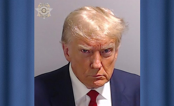 This booking photo provided by Fulton County Sheriff’s Office, shows former President Donald Trump on Thursday, Aug. 24, 2023, after he surrendered and was booked at the Fulton County Jail in Atlanta. (Fulton County Sheriff’s Office via AP)